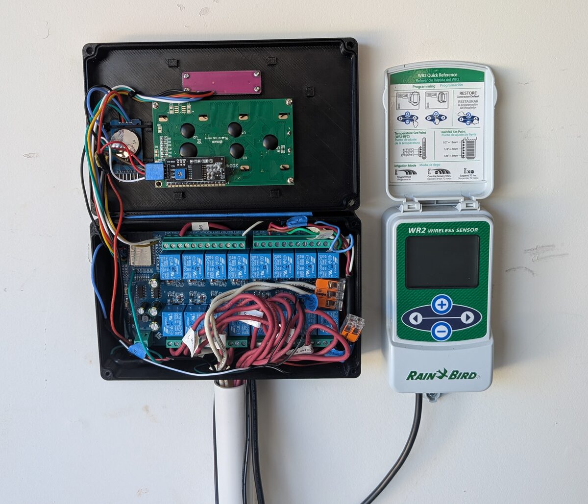 Controller mounted on the wall next to the Rain Bird WR2 receiver