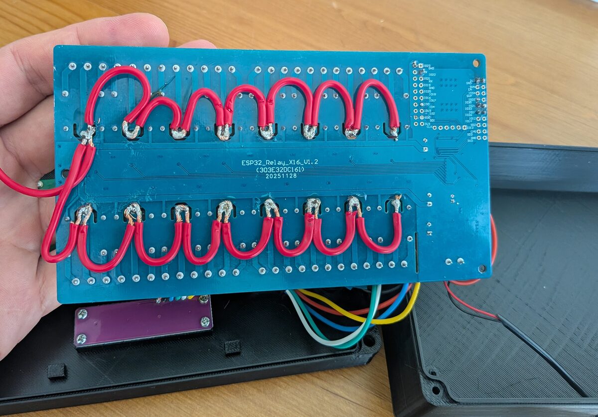 Common wire soldered across all relays on the underside of the board
